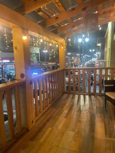 a bar with a view of a city at night at Hotel towi in Creel