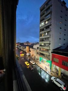 a view of a city street with cars and buildings at Hotel Andes INN in Guayaquil