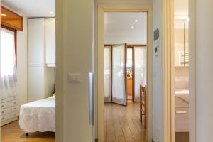 Postel nebo postele na pokoji v ubytování Prestige Garda Home - La Madonnina + 26 fotografií