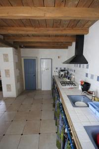 a kitchen with a sink and a counter top at House on the hill, near Aubeterre-sur-dronne in Saint-Romain