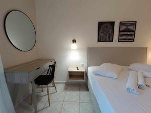 Postel nebo postele na pokoji v ubytování Faros Apartments