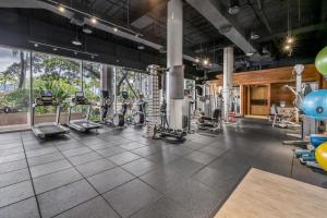 a gym with treadmills and elliptical machines at The Landmark #2705 in Honolulu