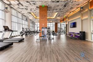 a gym with treadmills and cardio equipment in a room at Bayview Luxury, 3BR Condo, Stunning Amenities in Hollywood