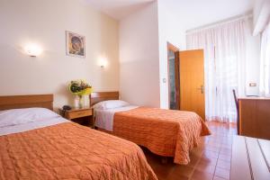 Postel nebo postele na pokoji v ubytování Hotel Casa Tra Noi