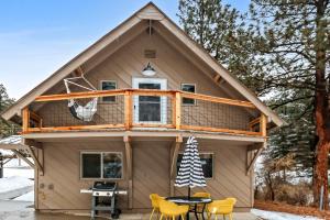 a tiny house with a wrap around deck at Boho Modern Retreat with Mountain Views Unit 1 Durango in Durango