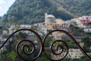 a wrought iron fence with a view of a city at Positano Casa Delizia in Positano
