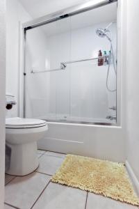 a bathroom with a glass shower and a toilet at Boho Modern Retreat with Mountain Views Unit 1 Durango in Durango