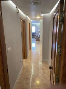 a hallway with a hallway leading to a living room at Parque De Las Naciones Europa II in Torrevieja