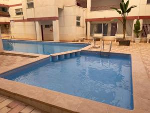 a large swimming pool in front of a building at Parque De Las Naciones Europa II in Torrevieja
