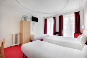 a hotel room with two beds and red carpet at Altona in Paris