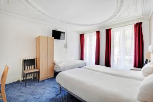 a hotel room with two beds and red curtains at Altona in Paris +14 photos