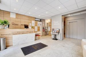 a lobby of a hotel with a counter and a reception at Altona in Paris