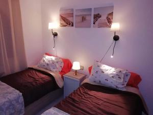 Postel nebo postele na pokoji v ubytování Residencial Sol Suite 2 + 37 fotografií