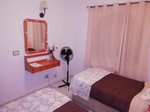 Postel nebo postele na pokoji v ubytování Residencial Sol Suite 2