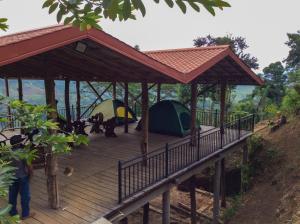 a wooden deck with tents on top of it at Deltota Lake View Camping in Deltota