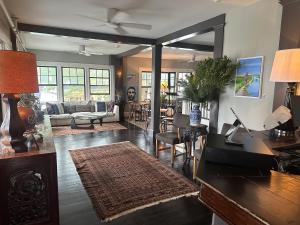 a living room with a couch and a table at Gifford House in Provincetown