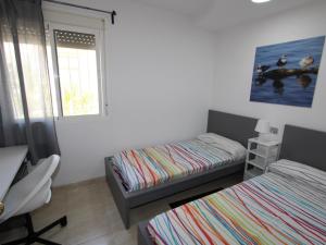 Postel nebo postele na pokoji v ubytování Casa cerca del mar con piscina privada, wifi, aire opcional, mascotas bienvenidas, playa para perros. - ES-184-55 + 19 fotografií