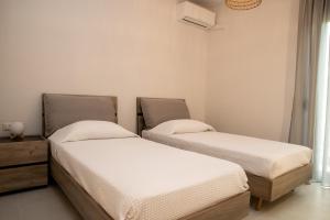 Postel nebo postele na pokoji v ubytování Cretan Roots Residence Elounda