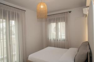 Postel nebo postele na pokoji v ubytování Cretan Roots Residence Elounda