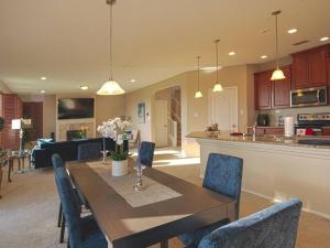 a dining room and kitchen with a table and chairs at A Charming Hill Country Home in Boerne