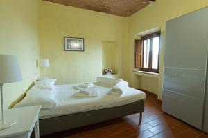 Ένα ή περισσότερα κρεβάτια σε δωμάτιο στο Borgo Gatteraia