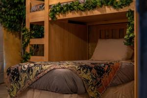 a bedroom with a bunk bed with plants on it at Stay at Hogwarts Harry Potter's Home, Free Parking, Pets Allowed in Kissimmee