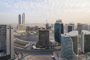 a view of a city with tall buildings at Frank Porter - Mada Residences in Dubai