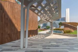 awning over a sidewalk in front of a building at Frank Porter - Index Tower in Dubai