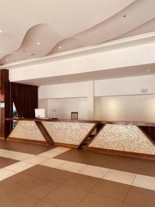 a large room with aasteryasteryasteryasteryasteryasteryasteryasteryasteryasteryastery at Bahari Studio Beach Front Apartment. in Diani Beach +23 photos