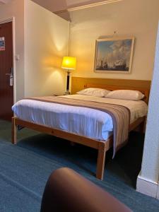 Cama o camas de una habitación en Hotel 24