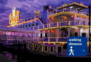 a cruise ship with a walking distance sign in front of it at Luxury Apartments in Puerto Madero in Buenos Aires