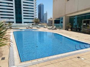 a swimming pool in the middle of a building at Frank Porter - Marina Heights in Dubai