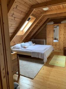 a bedroom with a bed in an attic at Tulipános vendégház in Fertőszentmiklós