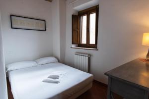 Ένα ή περισσότερα κρεβάτια σε δωμάτιο στο Borgo Gatteraia