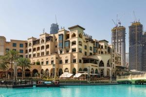 a large building next to a body of water at Frank Porter - Mon Reve in Dubai
