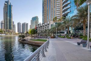 a city with tall buildings and a body of water at Frank Porter - Marina Tower in Dubai