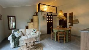 a living room with a couch and a table at Finca Valle Verde in Alora
