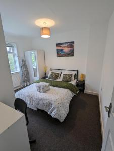 a bedroom with two beds in a room at Fantastic 3-Bedroom House in London in Morden