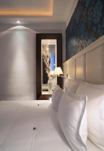 Una cama o camas en una habitación de Garni Hotel Crystal
