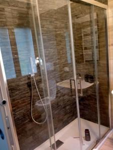 a shower with a glass enclosure in a bathroom at SERENDIPITY B&b in Fabriano +38 photos