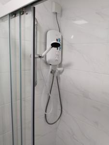 a shower in a bathroom with a shower head at Holiday SweetHome at Forest City 2BR1B with TV Box 4-6pax 1807 in Gelang Patah