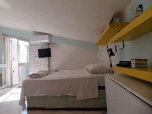 Postel nebo postele na pokoji v ubytování Casa di Arturo Mansarda