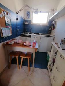 Kuchyň nebo kuchyňský kout v ubytování Casa di Arturo Mansarda