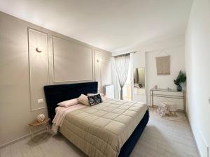 a bedroom with a large bed in a room at Casa Vivì in Porto SantʼElpidio