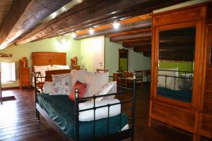 a bedroom with two bunk beds in a room at SUD room Palazzo Rau della Ferla in Noto