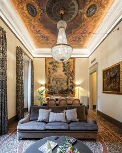 a living room with a couch and a ceiling at This Time Tomorrow in Florence in Florence
