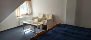 Postel nebo postele na pokoji v ubytování Rezidence Lipka