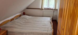 Postel nebo postele na pokoji v ubytování Rezidence Lipka