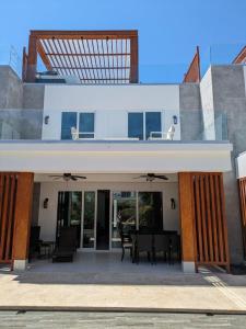 a view of a house with a patio at Dolphin Villa #09 in West Bay