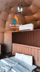 a bed in a room with a run island luxury centre sign at RUM iSLAND LUXURY CAMP in Wadi Rum